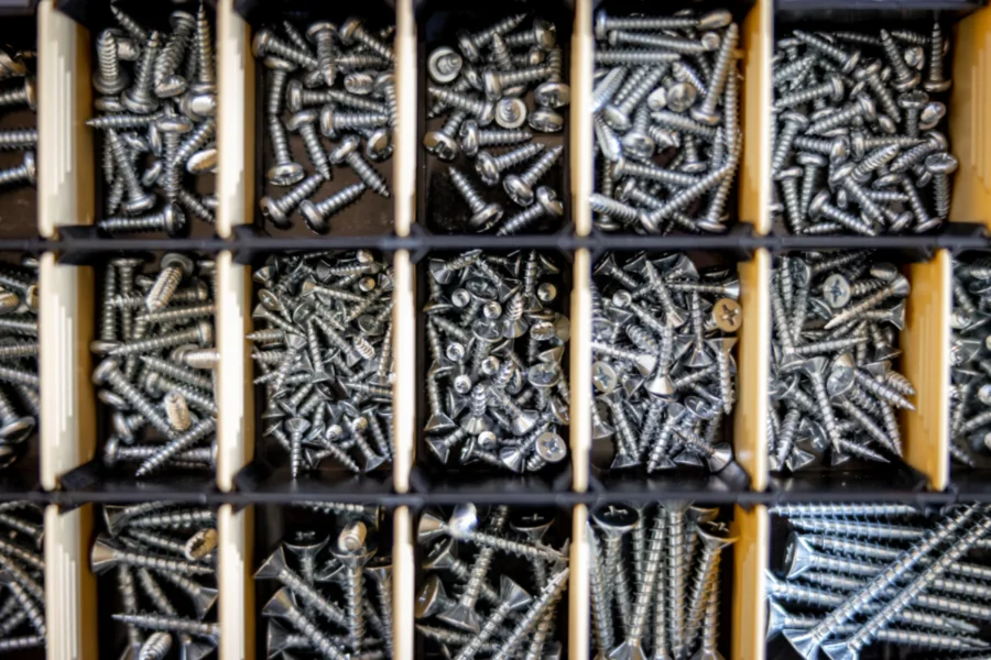 Organised bins of screws and small replacement parts